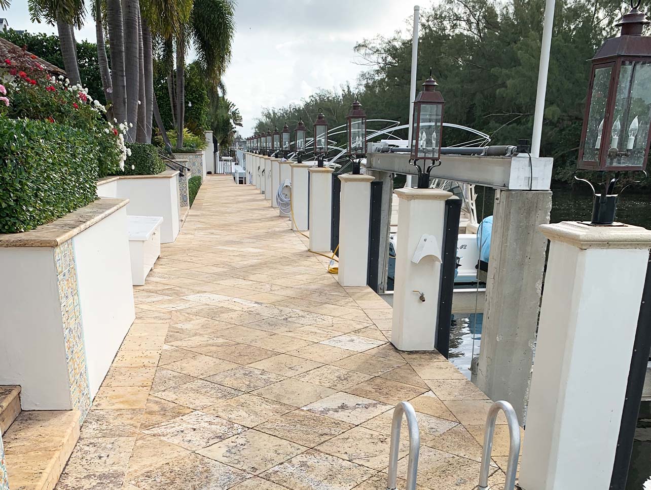 Travertine waterfront deck cleaned by Aqua Force