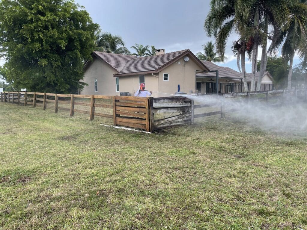 Pressure cleaning a home exterior and fence line